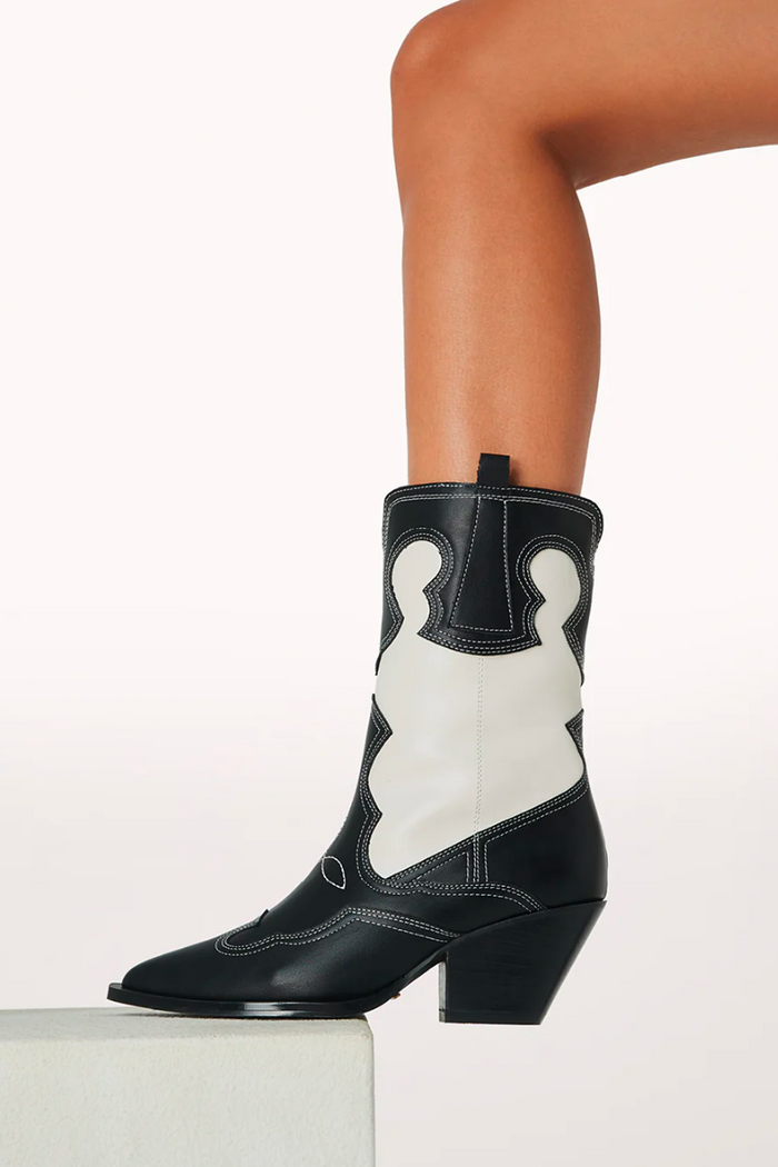 black and white pointed toe boots