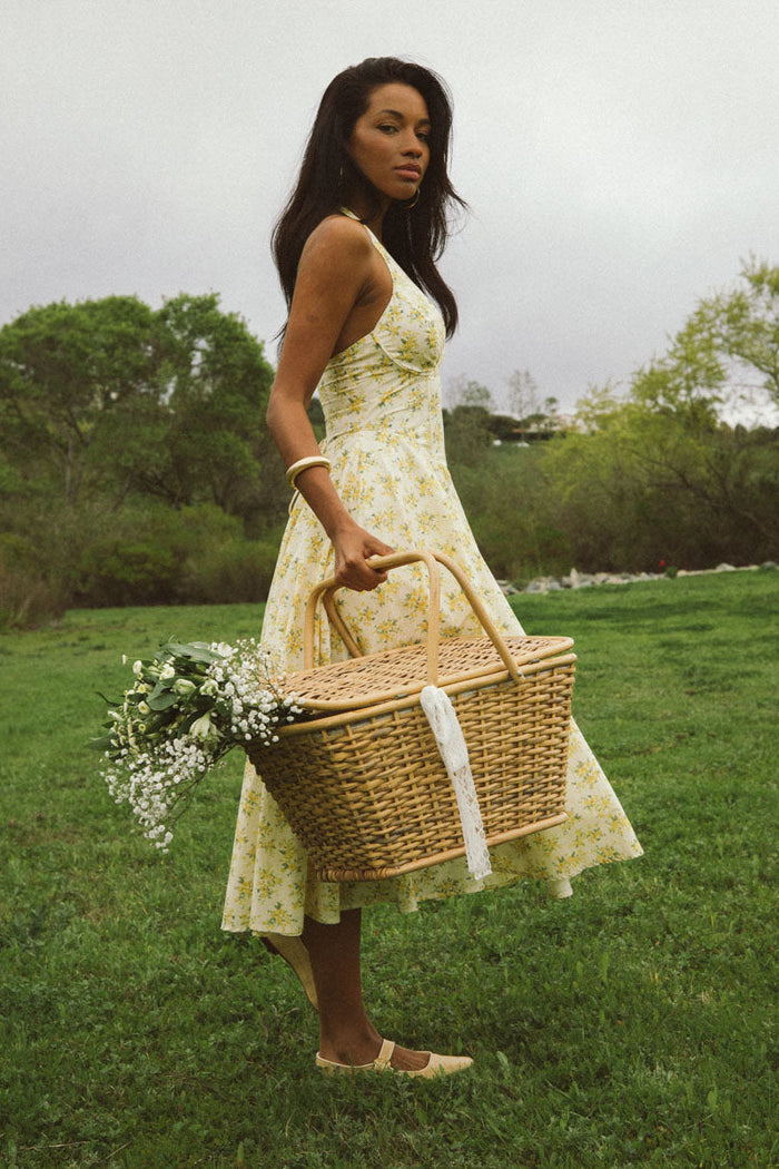 side-image | floral print dress | breezy | the dress viewed from the side, emphasizing the free-flowing skirt and halter neck design
