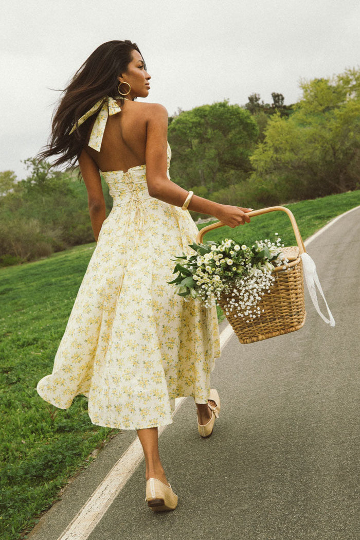 back-image | floral print dress | graceful and airy | the dress from the back, showcasing its simple yet elegant design and flowing skirt