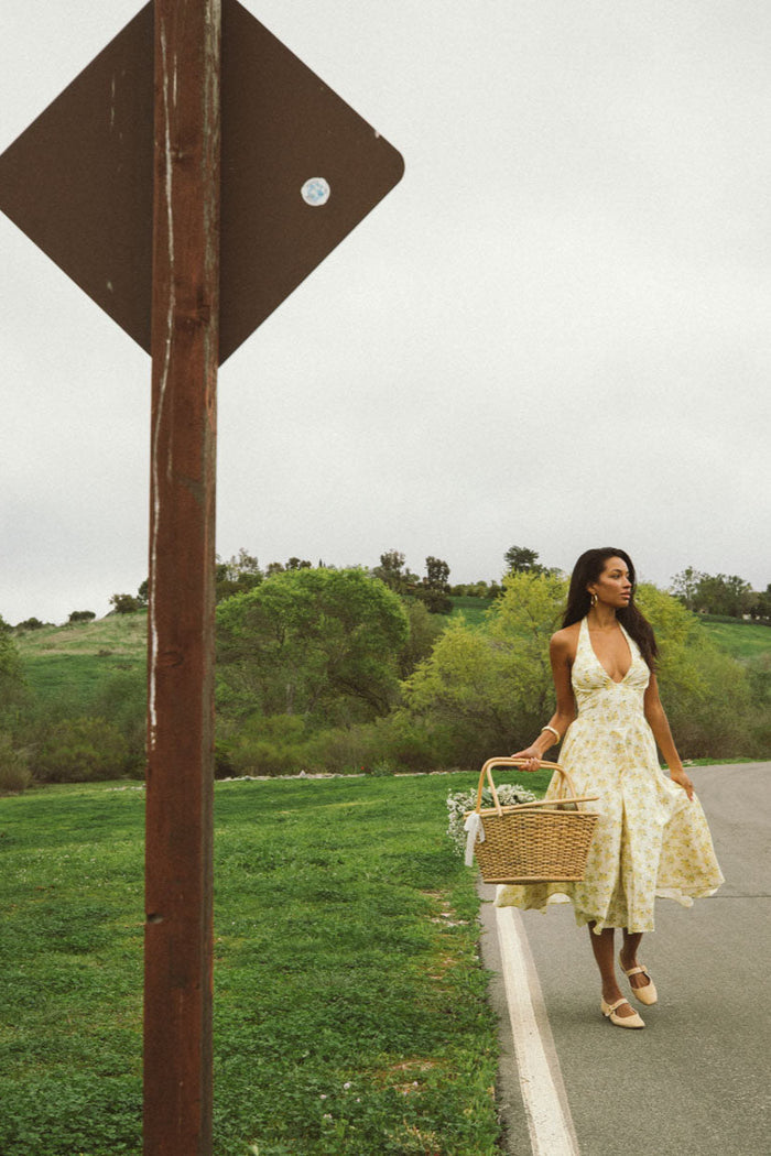 full-image | floral print dress | the dress worn fully, twirling with the flowing skirt, a perfect casual day outfit