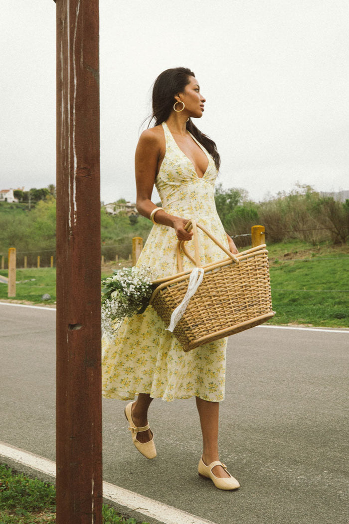 front-image | floral print dress | lively and sunny | a front shot of the dress, captured in motion, showing the skirt's full flow
