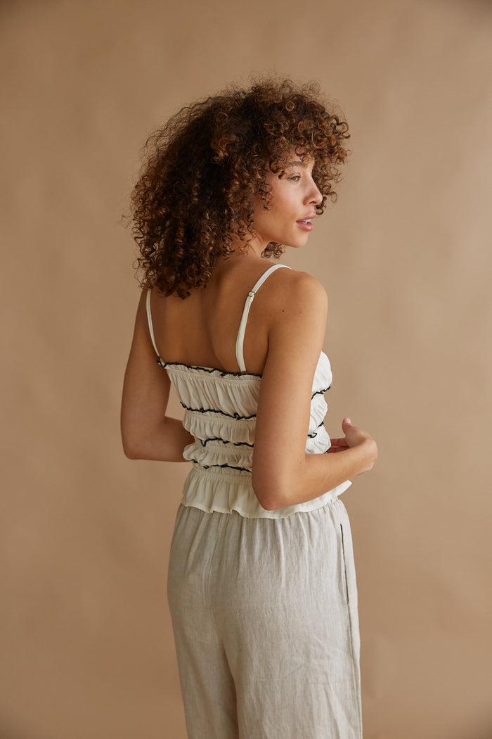 white smocked top with black trim | ruffle tank top