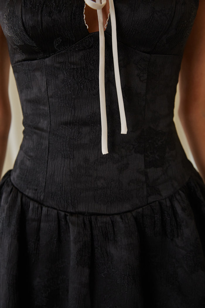 detail-image | black and white mini dress | corset mini dress | bow detail black mini dress | sweet mini dress