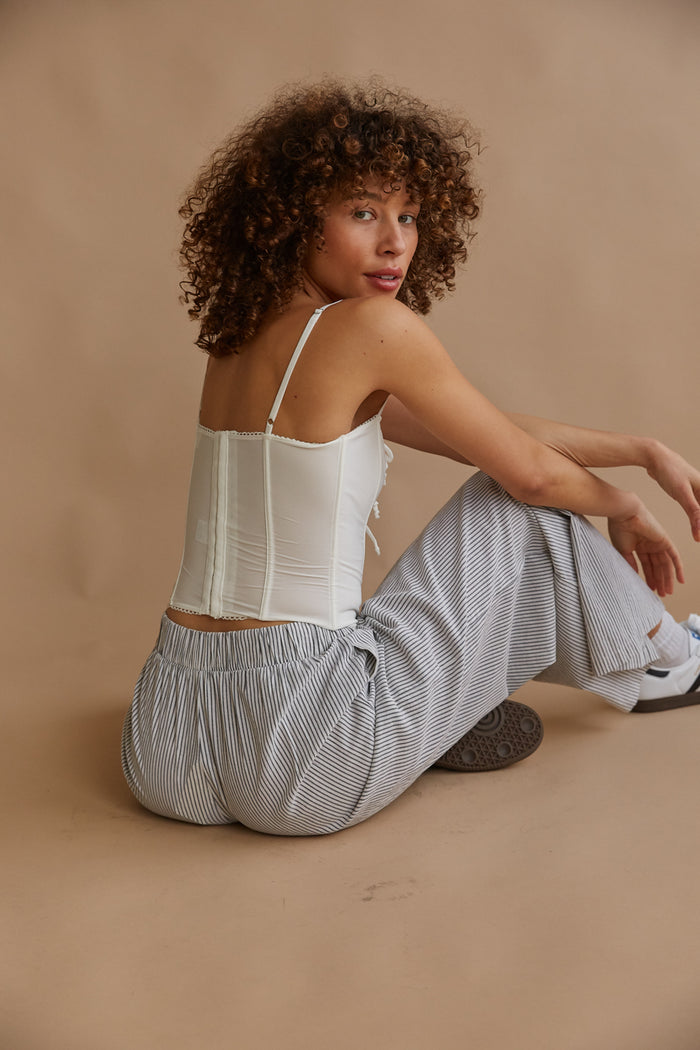 white eyelet trim bow coquette corset top | unique tops for spring summer 2024