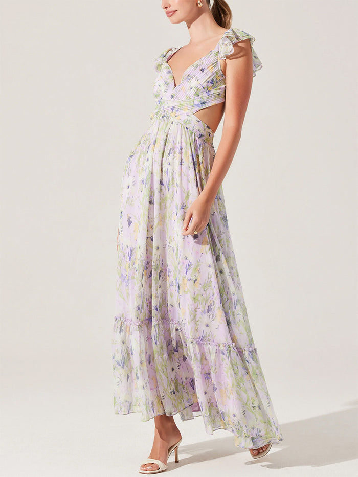 side-image | floral maxi dress | graceful and flowy | the dress captured from the side, emphasizing the tiered ruffles and soft silhouette