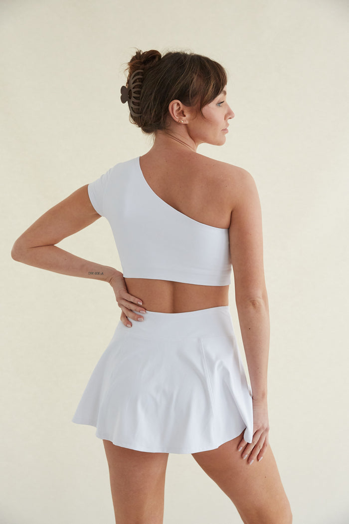 White high-waisted fit and flare tennis skort with built in shorts