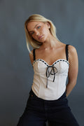 cream and black contrast corset top with velvet ribbon detail