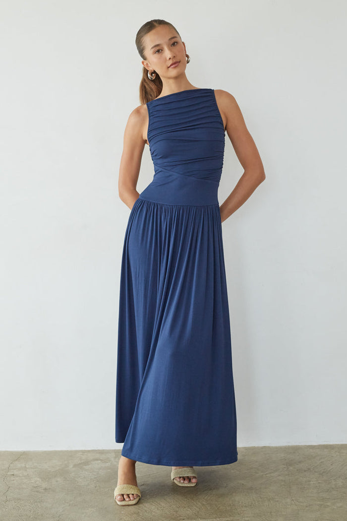 blue-image | Woman wearing a blue dress against a white background