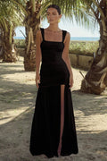 black-image | front image | Carly Maxi Dress | front view showcasing a fitted bodice with pleating and a thigh-high slit, emphasizing the elegant look.