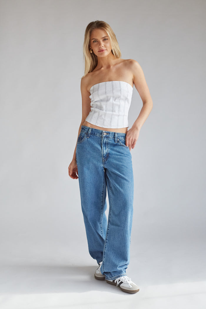 white strapless mid length corset top with thin black vertical stripes | olivia rodrigo style steal