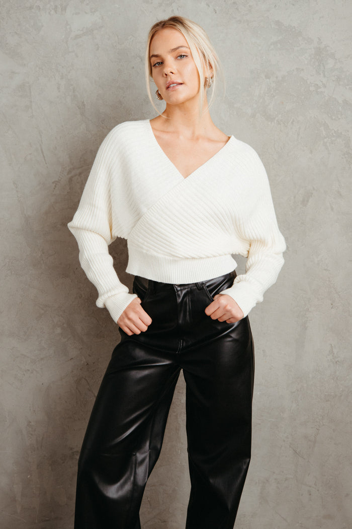 white criss cross open back sweater - white sweater outfit for fall - faux leather pants | white-image