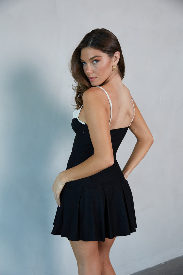 side-image | pleated mini dress | black and white mini dress | little black dress | contrast mini dress