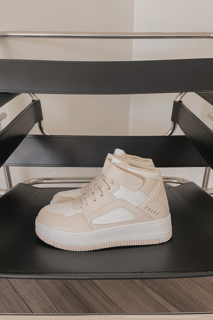 white and beige sneakers