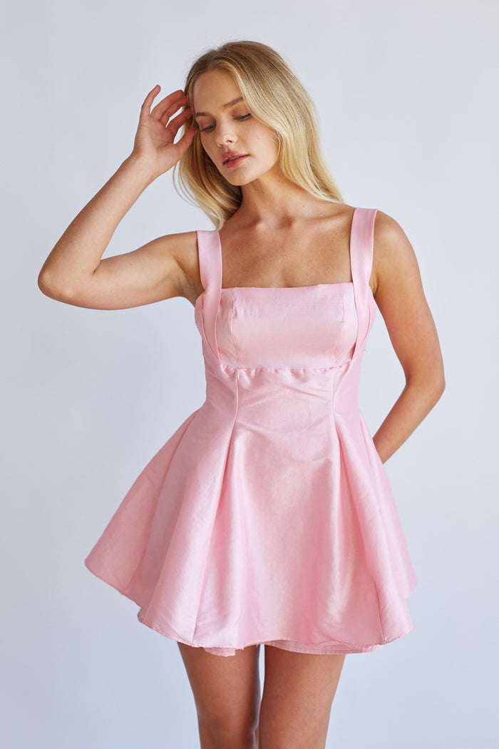pink image | Detail-image | Square Neck Babydoll Mini Dress | close-up of the pink dress with a square neckline and delicate fabric texture.