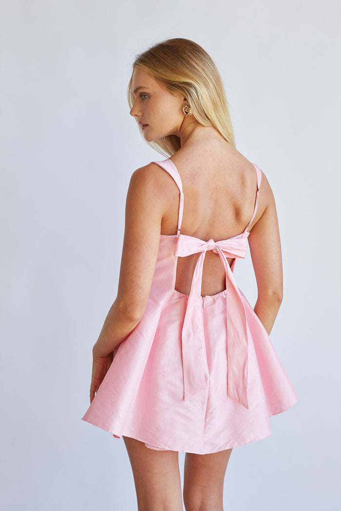Back-image | Square Neck Babydoll Mini Dress | back view showcasing the smooth fabric and slight flare of the skirt.