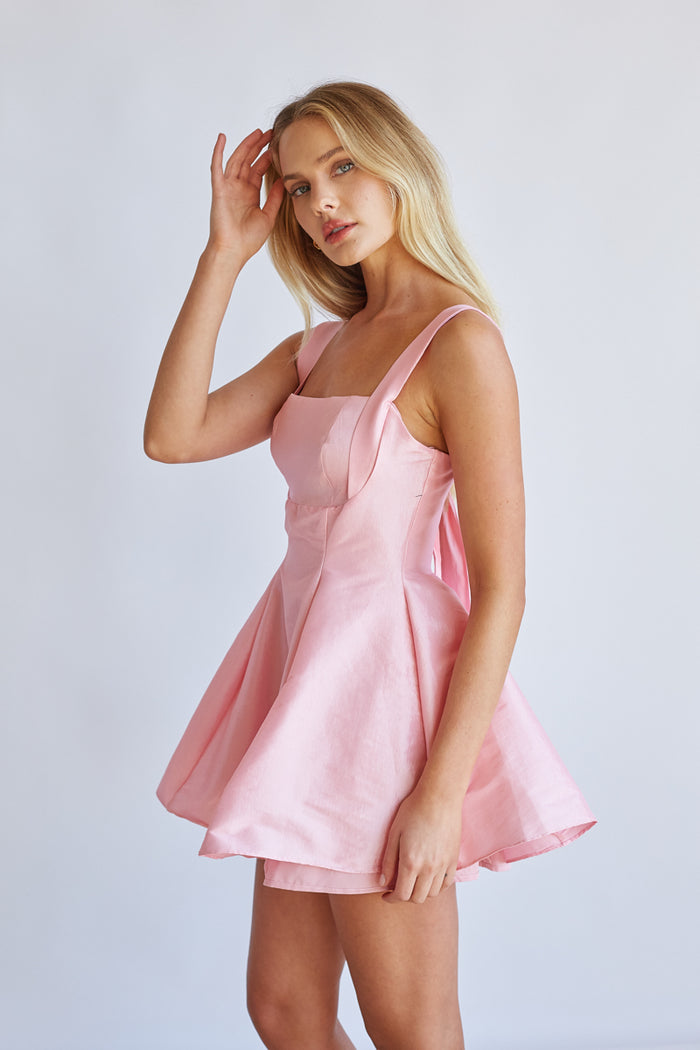 Side-image | Square Neck Babydoll Mini Dress | side view highlighting the structured bodice and voluminous skirt.