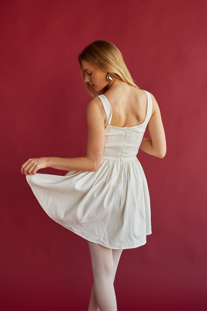 ivory fit and flare mini dress with low scoop neckline | trendy graduation mini dress for class of 2024