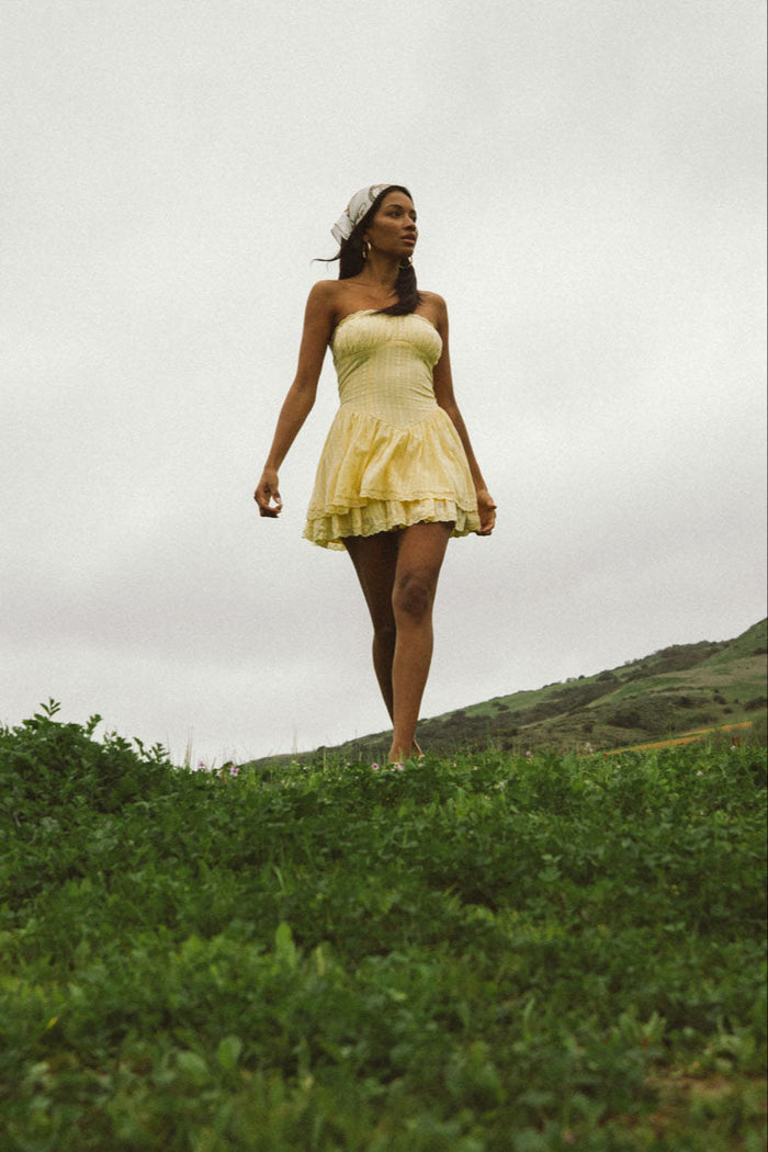 yellow-image | Front-image | Bustier Mini Dress | front view showcasing a strapless yellow bustier mini dress with a pleated bodice and flared skirt.