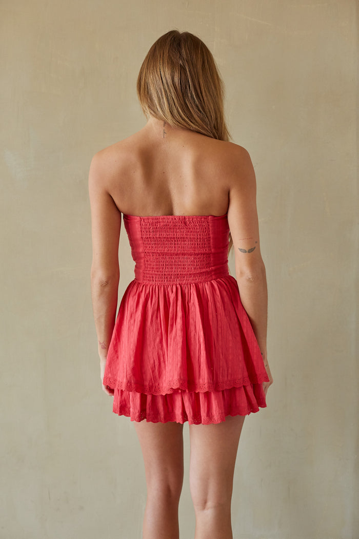 Back-image | Bustier Mini Dress | back view showcasing the fitted bodice and the simple design of the flowy skirt.