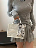 Elegant Structured Handbag with Printed Scarf Bow â€“ Classic Chic Style | Delicado