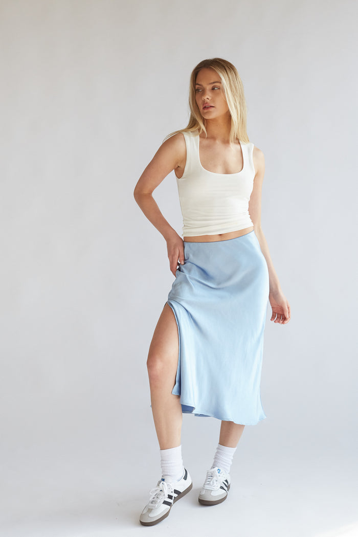 pastel blue satin shin length skirt with side slit | elevated basics for spring 2024