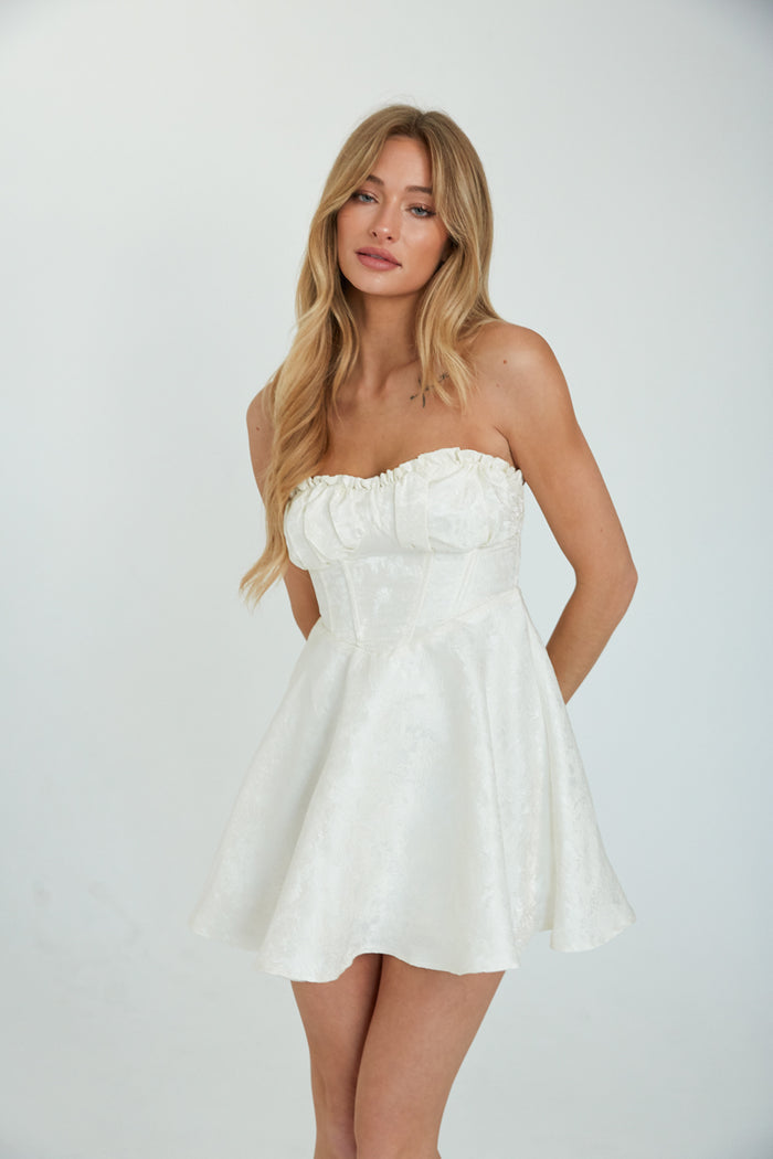 front view white strapless babydoll mini dress with corset structure  | hoco mini dress | graduation mini dress | bride to be
