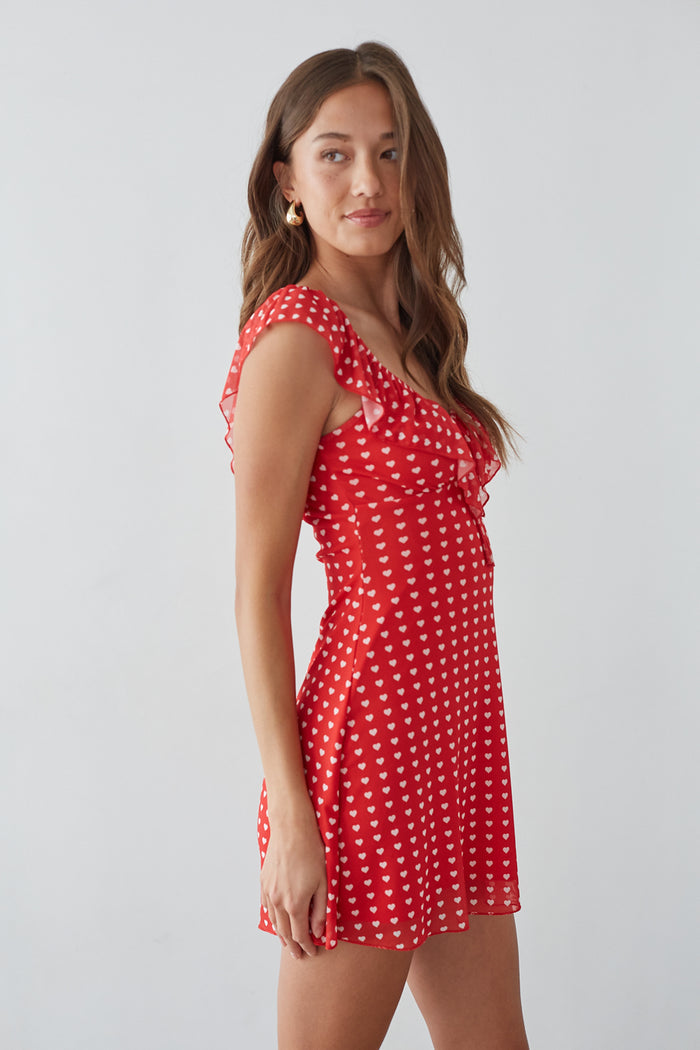 side-image | flirty date night dress | cap sleeve mini dress | retro-inspired summer style | red heart-print dress with flutter sleeves and a fitted bodice
