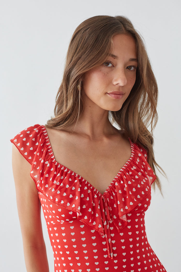 front-image | playful red summer dress | lightweight heart-print dress | trendy short dress | charming red mini dress with delicate details and a flattering fit
