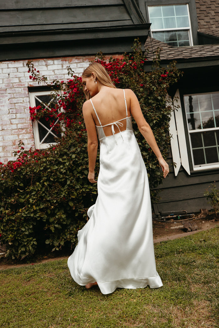 white open back satin maxi dress with ruffle hem