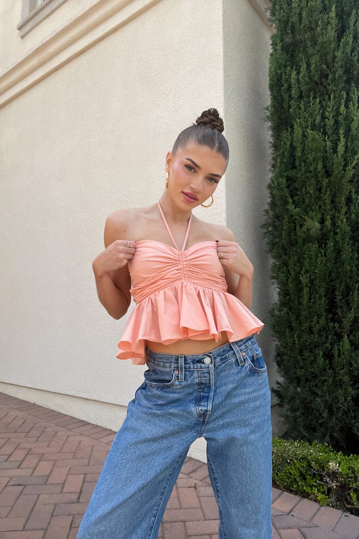 coral peplum halter top