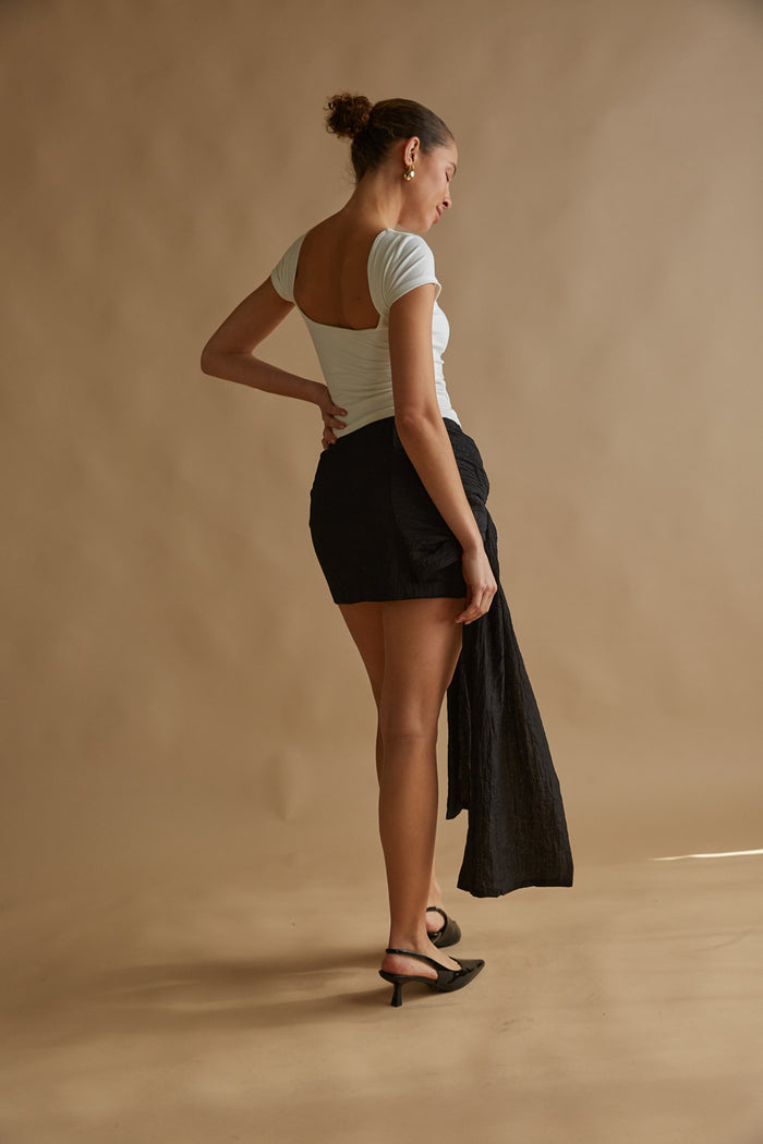 statement bow mini skirt with side drape