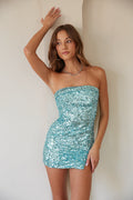 blue-image | A lady in a strapless turquoise sequin mini dress, ideal for hoco dresses or unique homecoming dresses.