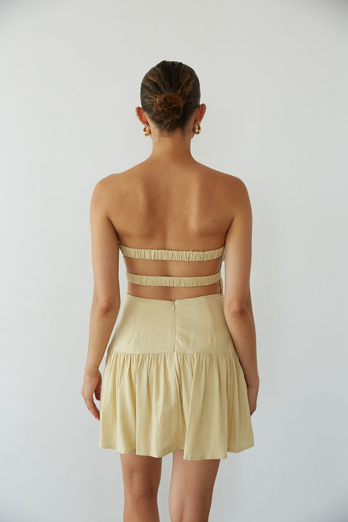 back view | yellow open back fit and flare linen mini dress