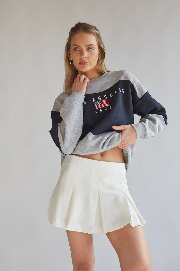 white pleated micro skort