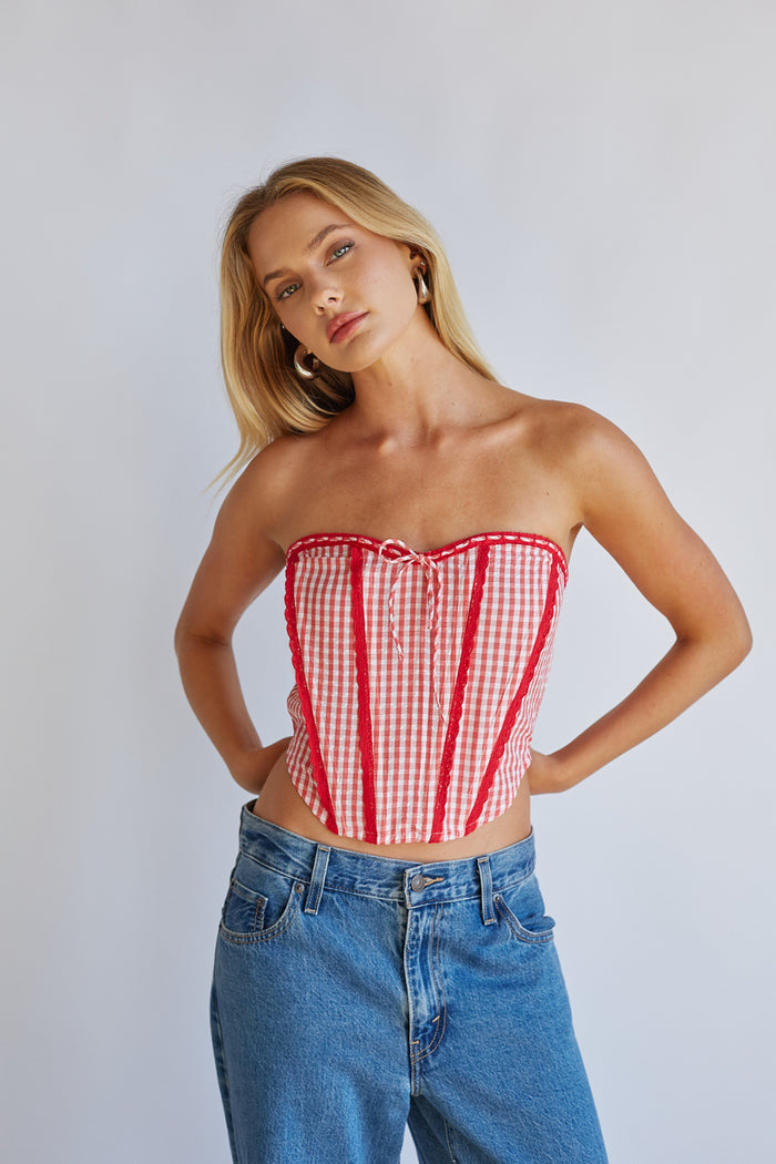 Detail-image | Gingham Front Tie Corset | close-up of the front tie detail and gingham fabric texture of the corset.