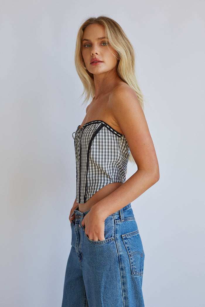 Side-image | Gingham Front Tie Corset | side view focusing on the structured silhouette and clean lines of the corset top.