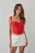 white-image | Front-image | Eyelet Lace Mini Skort | front view showcasing the red lace tie-top and white eyelet lace mini skort with floral detailing.