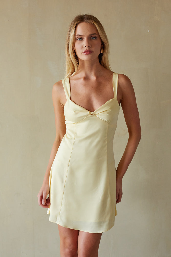 yellow-image | Front-image | Front Twist Tie Back Mini Dress | front view showcasing a yellow mini dress with a twist tie detail and a fitted bodice.