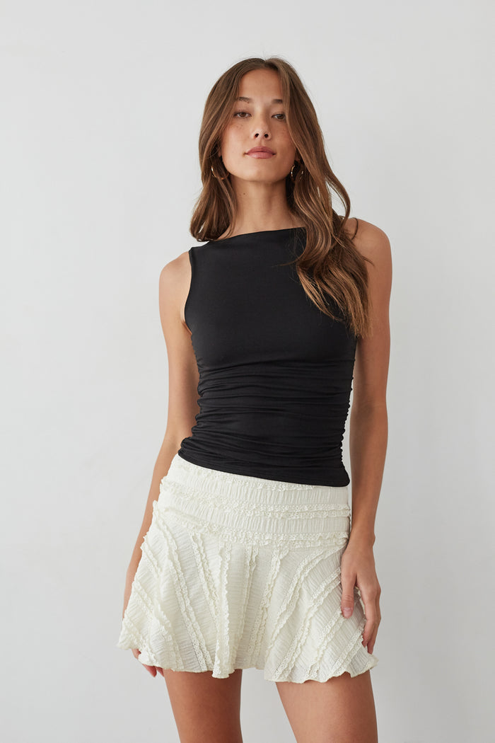 Front-image | Lace Skater Skirt | front view displaying the flattering black top with ruching, paired with the flowy lace skirt.