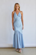 blue-image Front-image | Satin Midi Dress | front view showcasing a halter neck design with a fitted bodice and a flowing, tiered skirt in light blue satin.