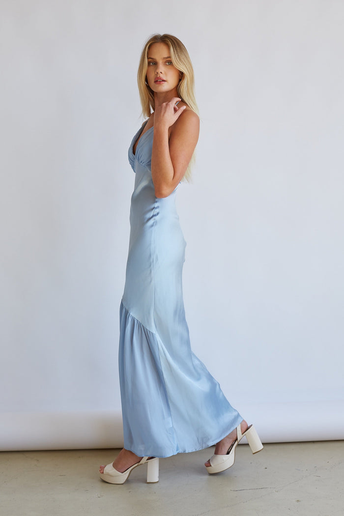 Side-image | Satin Midi Dress | side view showing the smooth light blue satin fabric, flattering silhouette, and flared hemline.