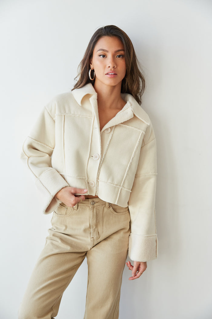 white sherpa jacket with contrast stitching - cream sherpa lined suede jacket - winter outfit inspo