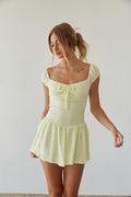 front view | bright pastel yellow lace puff sleeve mini dress | summer dress outfits | yellow image