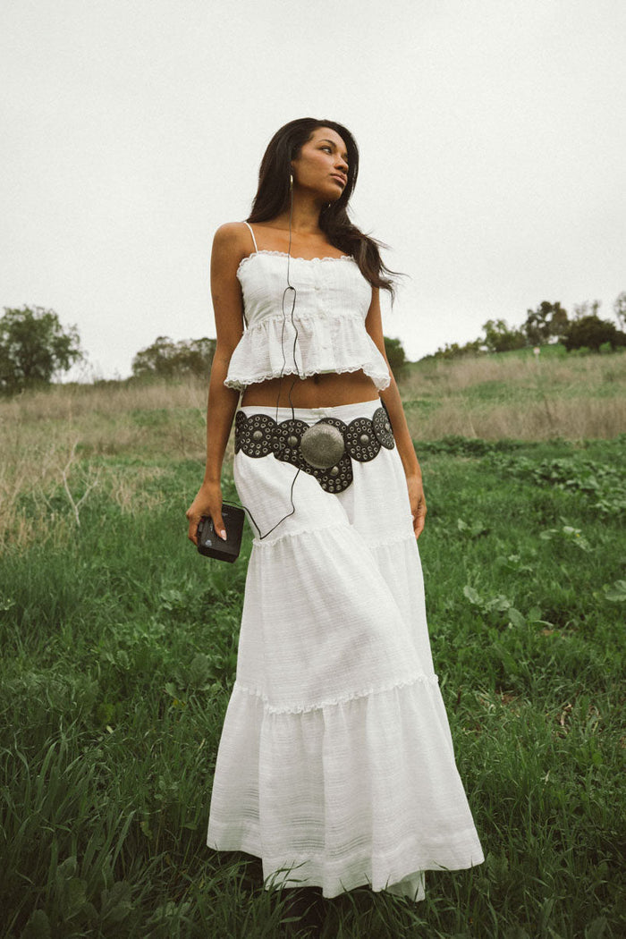 front-image | peplum white top | casual and breezy | front view of the top highlighting the fitted bust and flowy peplum design.