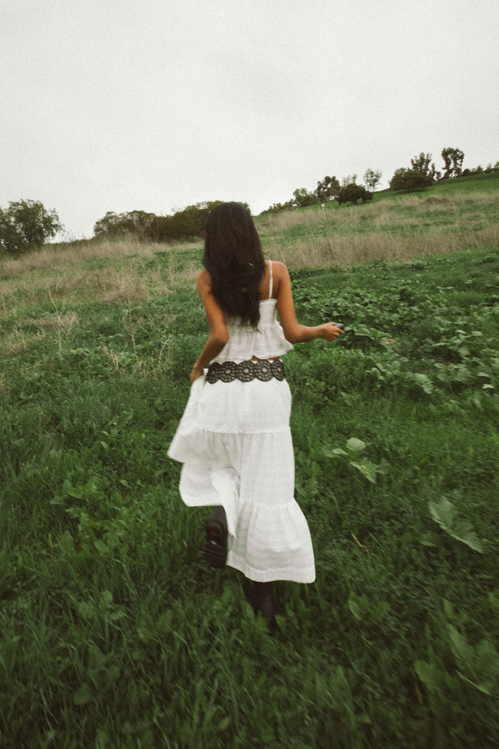 back-image | peplum white top | simple and airy | back view showing the lightweight fabric and flattering fit of the top.
