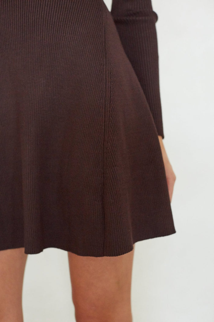 Brown ribbed sweater and skirt set on a plain background