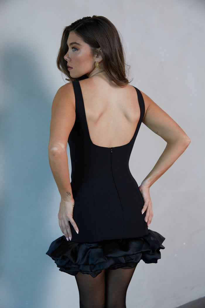 Back-image | Boatneck Bubble Bodycon Mini Dress | back view revealing the sleek back and zipper closure of the dress.