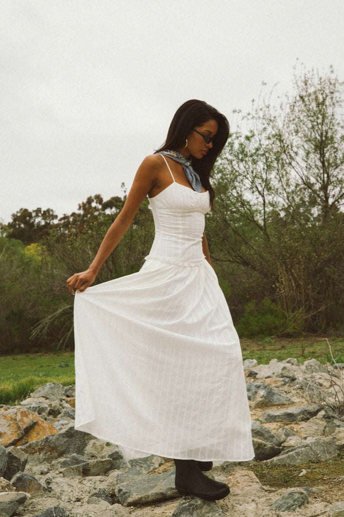 side-image | white maxi dress | the dress viewed from the side, highlighting the flattering fit and relaxed silhouette