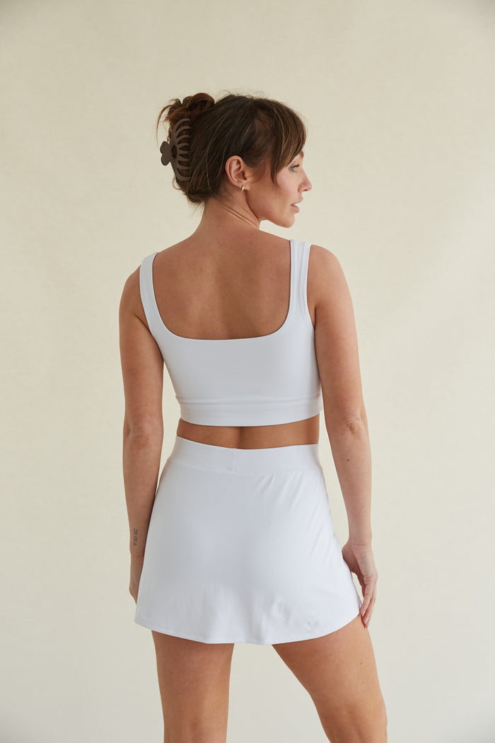 Straight cut white skort with side slit and built-in shorts