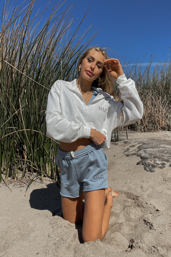 white zip up hoodie.